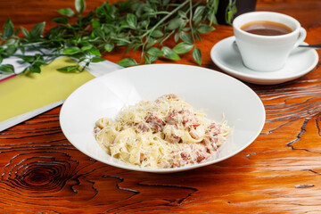 Pasta with bacon and parmesan cheese. Lunch.