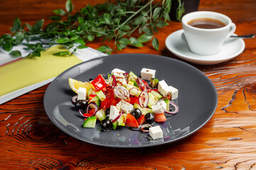 Greek salad, tomatoes, cheese, olives, cucumber. Lunch.