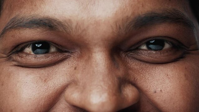 Portrait of Indian Man with Happy Face and Smiling Eyes Looking at Camera Close Up. Joyful Emotional Vision of Nice Ethnic Person with Charming Features. Modern Concept of Asia Citizen in Good Mood