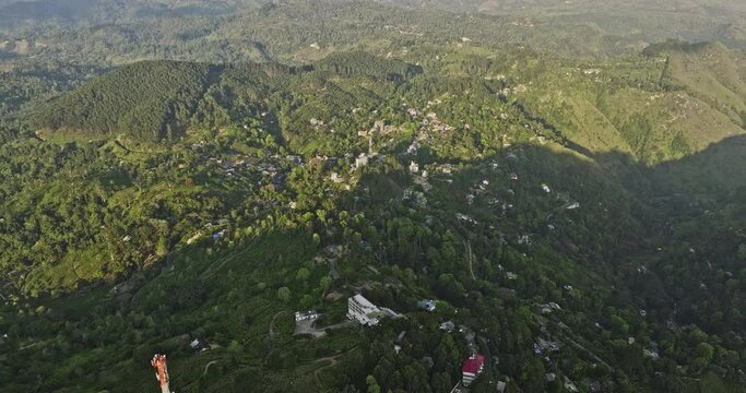 Ella Sri Lanka Aerial v4 birds eye view drone flyover hillside residential and resort hotels capturing natural landscape of mountain terrains and verdant valleys - Shot with Mavic 3 Cine - April 2023