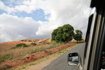 Madagascar paved road as seen from inside a Land Cruiser