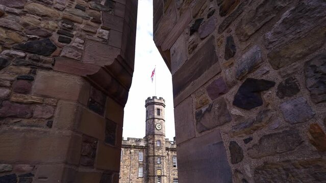 Edinburgh castle in Scotland. Clock tower, the crown room, crown jewels of Britain. Historic medieval fortress in old town. Travel destination, tourism landmark in UK.
