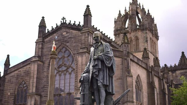 Adam Smith Statue in Edinburgh Old town Scotland. Royal mile tourism landmark, tourist destination in UK.

