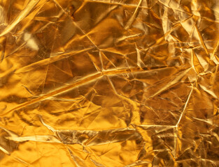 Crumpled gold background as an abstraction. Texture