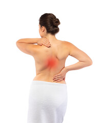 Young woman massaging back pain on white background
