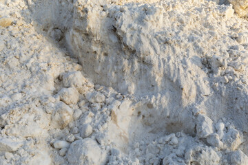 Dirty snow mixed with sand, background texture