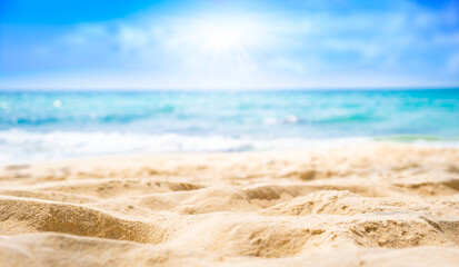 Beach sand for summer vacation concept. Beach nature and summer seawater with sunlight light sandy beach Sparkling sea water contrast with the blue sky.Beach sand for summer vacation concept.	
