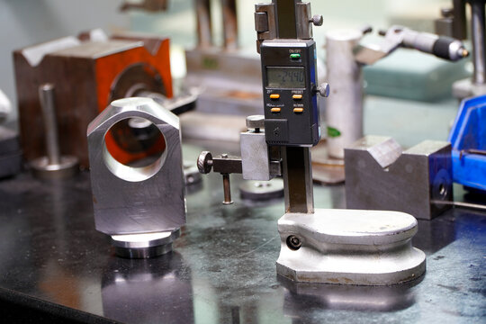 row of height gauges in an engineering lab,Caliper height gauge on surface plate and measure the product size on surface magnet
