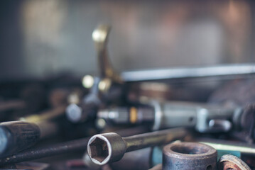 Heavy screw grungy rusted wrenches dirty screwdriver object. Industrial hardware set. Mechanic tools engineering equipment car auto repair shop with copy space. Blurred background mechanical service