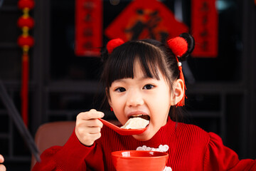 Eating dumplings during Chinese Festival, girls eat dumplings at home,