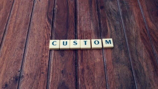 Custom- Stop Motion written with blocks for introduction purpose on wooden background