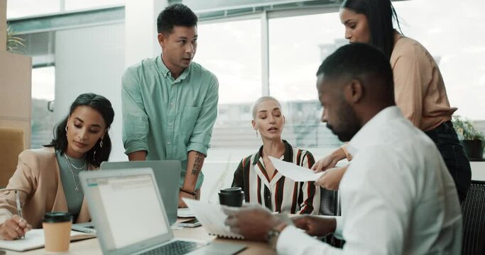 Business people in meeting, ideas with laptop and paperwork for proposal at creative startup. Teamwork, research and brainstorming at workshop, men and women in office with notes, strategy and plan.