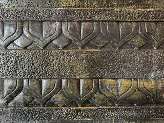Engraving or relief of an ethnic temple wall in Indonesia. Traditional crafts close up details with...