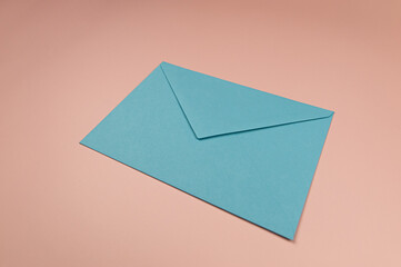Top view of light blue envelopes on pink background. Post flat lay. Copy space.