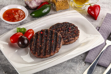 Grilled burger cutlet with sauce