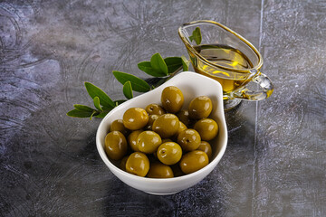 Ripe tasty green olives with branch