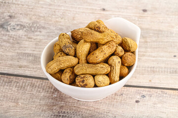 Raw ripe unpeeled peanut heap