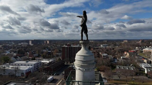 Drone shot of the bronze statue of George Washington atop the Trenton Battle Monument, Trenton, USA
