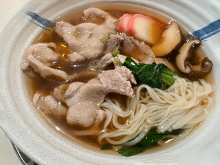 Soba noodle soup with pork and vegetable in a bowl