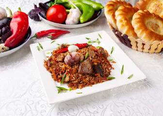 Pilaf with meat and garlic.
Eastern cuisine. Uzbek cuisine.