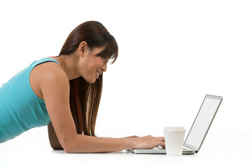 Asian Woman working on a laptop.