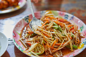 Close-up of spicy papaya salad on plate
