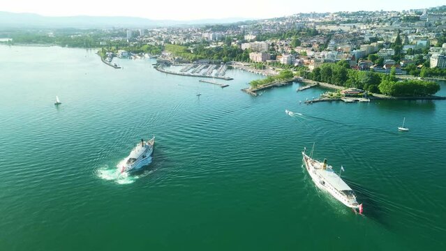 Drone Switzerland 4k. La Suisse steamboat ship on Lake Geneva. Swiss Flag. Geneva to Lausanne tour, Lac Leman, Switzerland summer tourism destination. Turquoise blue water.