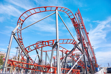 Roller coaster on blue sky