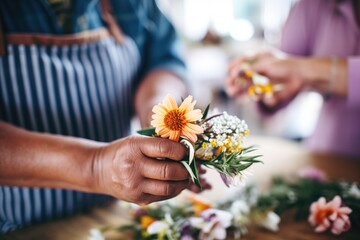 closeup of florists hands crafting a flower crown - obrazy, fototapety, plakaty