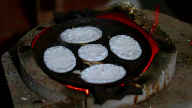 Making chitoi Pitha is one of the traditional food of Bangladesh. Bangladeshi Hand-Made Winter Pitha Cake-Making