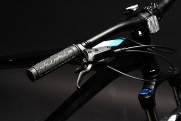 Close up of a bicycle against black background