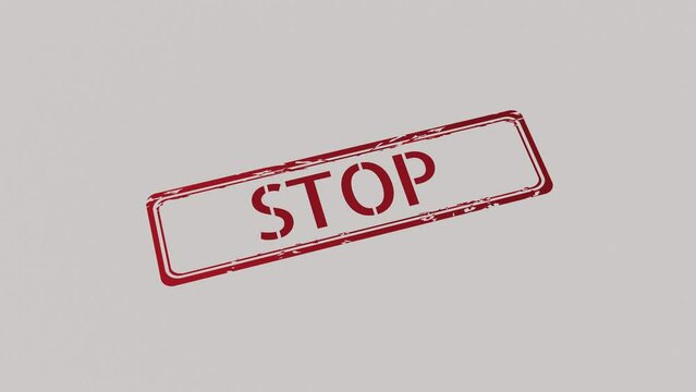 STOP Stamp pressing on a paper