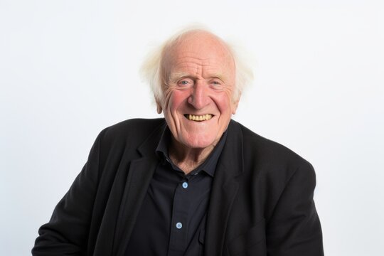 Old man making funny faces on a white background. Studio shot.