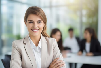 Obraz premium Portrait of smiling businesswoman in office with colleagues in the background