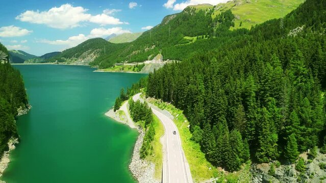 Aerial drone view of scenic drive to St. Moritz. scenic Bernina Pass in Swiss Alps. Switzerland summer tourism.