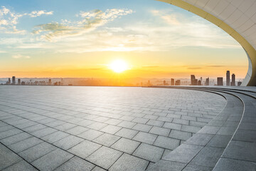 Empty square floor and city skyline scenery at sunset. High Angle view.