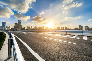 Asphalt road and city skyline with modern buildings scenery at sunset in Shanghai - obrazy, fototapety, plakaty