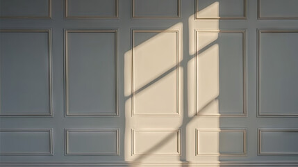 Light and shadows from window on  white wall indoors