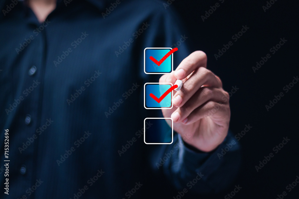 Poster checklist concept. businessman using pen checking mark on checkboxes.