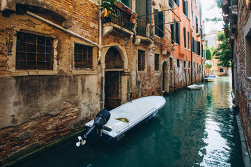 Venice narrow canal gondolas and boats