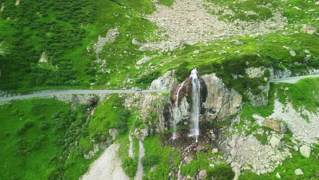 Aerial drone view of scenic Susten pass drive in Swiss alps. Switzerland summer tourism destination. Alpine road trip road.