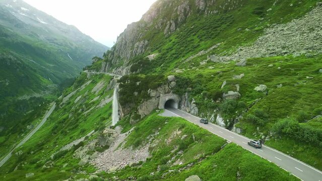 Aerial drone view of scenic Susten pass drive in Swiss Alps. Switzerland summer tourism destination. Alpine road trip road. 
