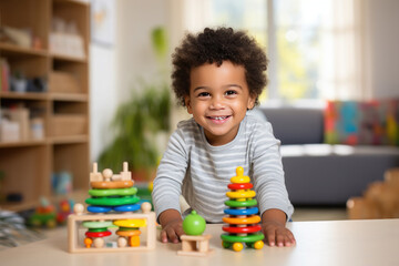 Little happy afro american dark skinned child plays with mentensorri toys, wooden educational toys at home or in kindergarten. The concept of education, child development, leisure.