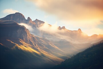 sunrise illuminating a mountain range with warm light