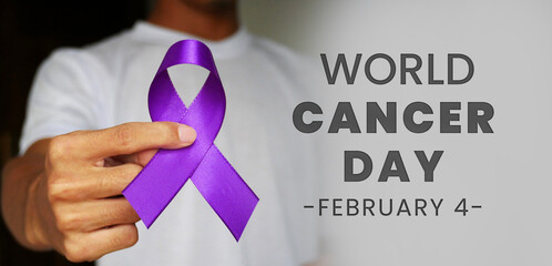 World cancer day, lavender purple ribbon to support people living with cancer. Raise awareness of...