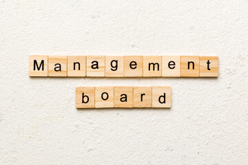 Management board word written on wood block. Management board text on cement table for your desing, concept