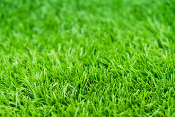 Close up of vibrant green artificial grass turf in residential.