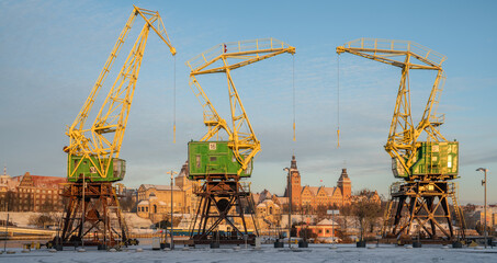 Historic harbour cranes decorating city boulevards in szczecin,Poland