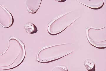 texture transparent gel serum on pink background