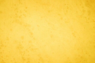 Yellow concrete stone texture for background in summer wallpaper. Cement and sand wall of tone...